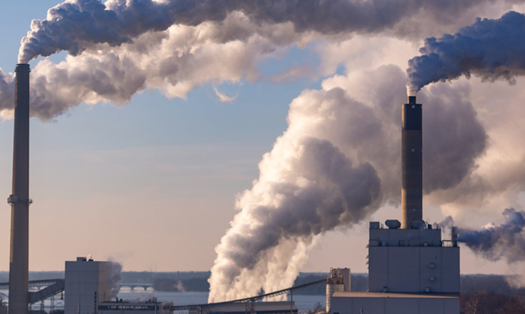 Smokestacks with billowing smoke